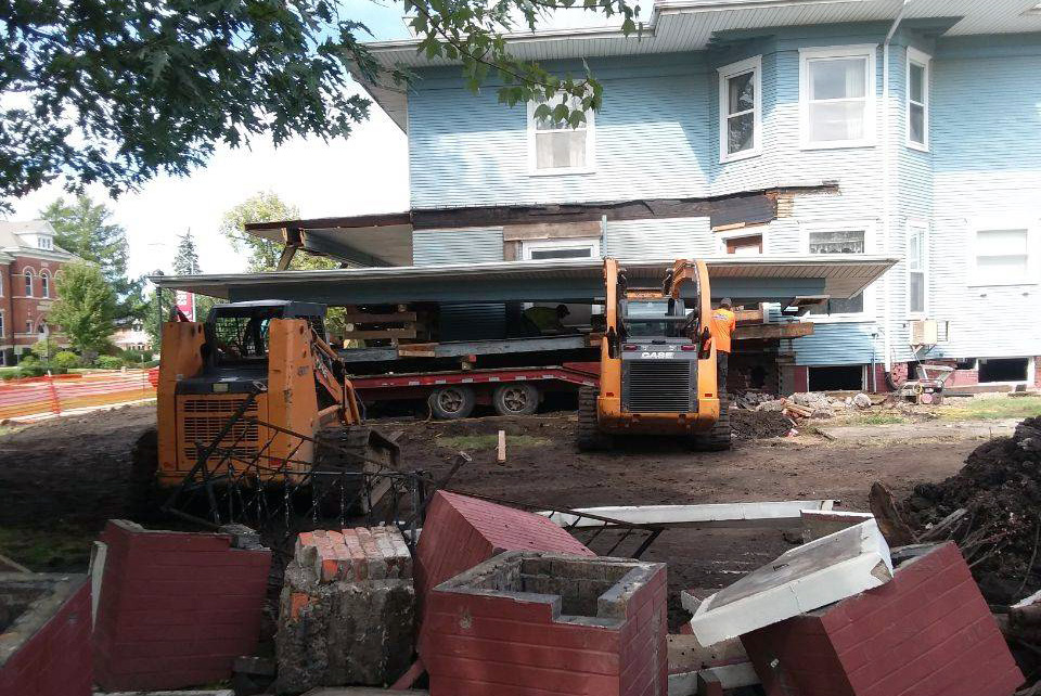 Pieces of the side porch brick columns have been removed from the house.