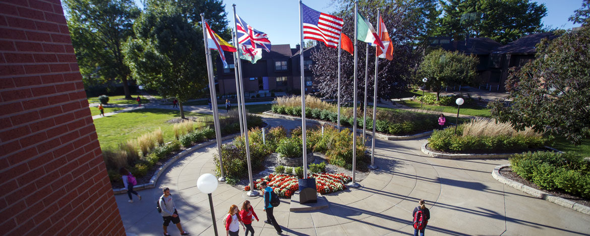 Photo of international flags outside the Weller Center for Business and International Studies.