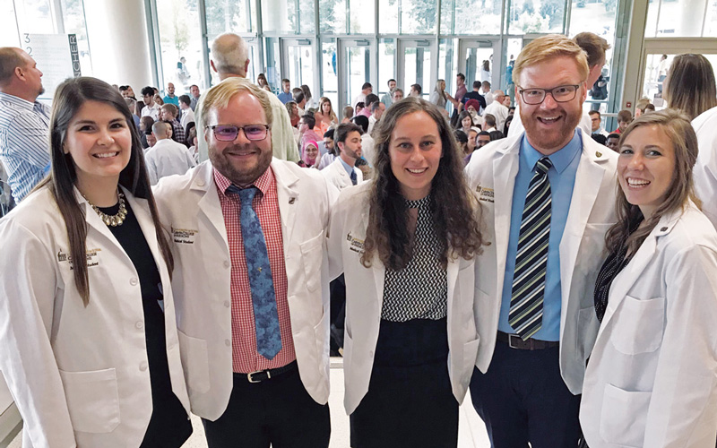 Five Central graduates celebrated together at the University of Iowa white coat ceremony earlier this year. Left to right: Ashley Radig ’16, Sam Palmer ’17, Abby Fyfe ’18, Nick Lind ’06 and Andie Arthofer ’17.